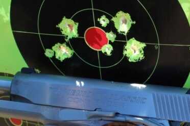 From 25 yards. Yes the smaller holes are from a different gun. We care about the environment and recycle here at GunsAmerica.