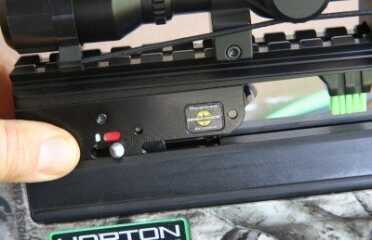 The safety automatically flips on when you draw the string across the release. You have to remember to turn it off to fire.  Note the sticker that says you have to use their bolts with the bumpy backs to them, but I tried others and they worked fine. 