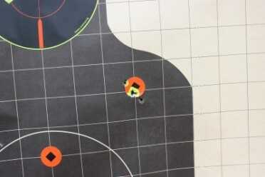 As I got more comfortable with the gun, the groups tightened. This is from 25, standing, with both hands in a traditional hand-over-hand grip.