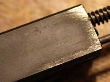 Look closely and you'll see the date of manufacture etched in on the bolt.