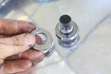 To understand the way the Presto canner works, the pressure is regulated by a weight over an air vent. The steam has to raise the weight so that a very small amount of steam escapes. These rings will control the pressure at 5, 10, or 15lbs pressure. 15lbs is only used at altitude. This is one ring on at 10 lbs. 