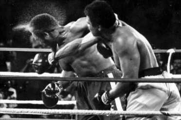 Why I Carry--It Happened to Me FILE - In this Oct. 30, 1974, file photo, perspiration flies from the head of defending champion George Foreman as he takes a right from challenger Muhammad Ali in the seventh round in their world heavyweight championship bout dubbed "Rumble in the Jungle" in Kinshasa, Zaire. Ali regained the world heavyweight crown by knocking out Foreman in the eighth round. (AP Photo/Ed Kolenovsky)