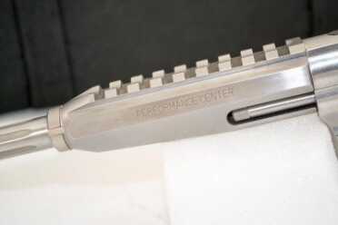 The rail segment is machined into the barrel shroud.