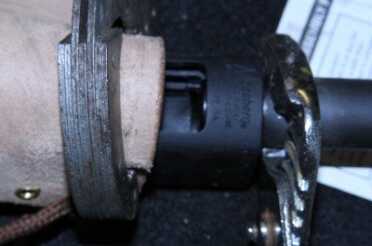 Getting the magazine tube off of your Mossberg 500 is not easy. I didn't have a vice set up so I used a pipe wrench and thick piece of leather to hold the receiver and some channel locks on the mag tube, which did get boogered up a bit. I don't plan to take the sidewinder off this gun, so the mag tube was going in the garbage anyway. 