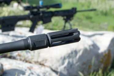 Smith & Wesson designed their own flash hider for the M&P 10 LE. It's intended to suppress both primary and secondary flash. It's also got ports that provide muzzle brake function.