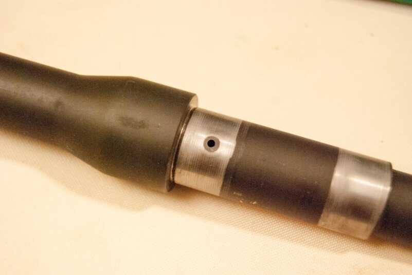 Build an AR-15: Direct Impingement or Piston Operation? Here's the barrel gas port, formerly under the front sight and gas block, which has been removed.