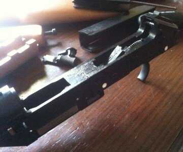 The barrel joins to this hunk of dense polymer which houses the trigger. 