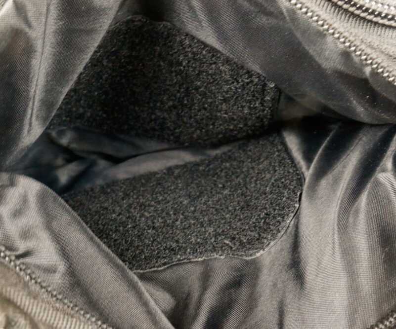 Trying to find a gun in this bag is no fun, as you slide these plastic-backed hook-and-loop panels under your fingernails. No lie--they draw blood. Shitty design. 