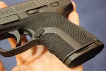 The smooth strip both adds a bit of contrast and points the way to the over-sized mag release.