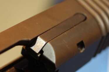 The pin that holds the extractor on is not drilled through, so there's no way it can shoot loose and fall into the action.