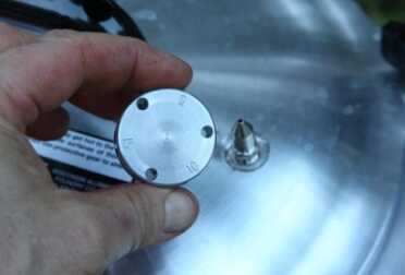 For this experiment I used my All American Canner with the 10 pound setting, once I had bled off the air in the pot. I knew the stove had a couple hours of fuel left, and the canning time for these 1/2 gallon jars is probably over 70 minutes. 