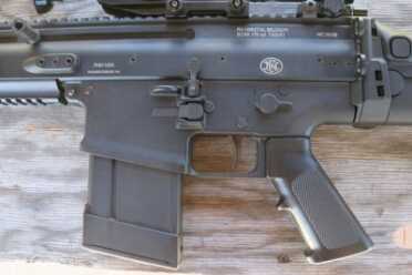 The SCAR uses a propriatary magazine. There are aftermarket options, like this plastic version, available. 