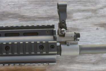 The hooded front sight is built into the gas block.