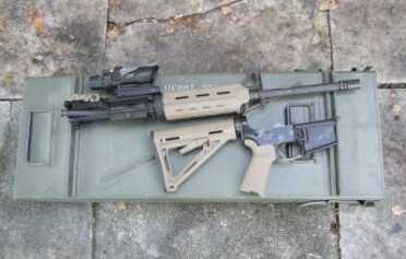 A taken down AR easily fits in the box can. 