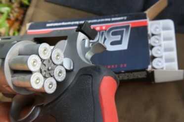 The rounds have to be pulled from the cylinder, whether brass or aluminum. They don't just fall out. 