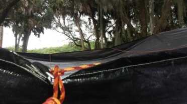 I found it nearly impossible without perfectly square mounting points to get the tarp to work properly, so I threaded the D rings with a rope to pull two edges up. It works now. 