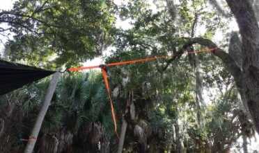 I also couldn't tie the corners off to the same height, so I had to guess at level. You can't tie the tarp square tight or it won't have a depression for the water, so it really is trial by error. 