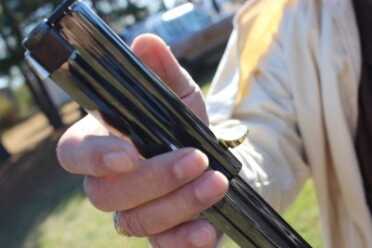 The sleeve twists open. This can take a bit to get used to, but comes more naturally with practice. 