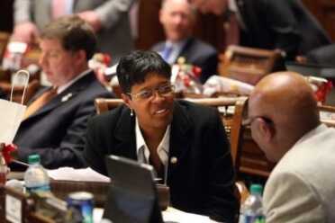Rep. Keisha Waites, D-Atlanta, speaks with Rep. Mickey Stephens, D-Savannah, right, on Feb. 15, 2012. (Photo: Jason Getz/AJC.com)