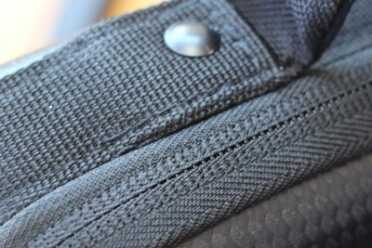 The zippers are sewn well, and protected nicely. Not water-proof, but almost.