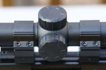 The scope rides close over the action, but doesn't impede ejection.