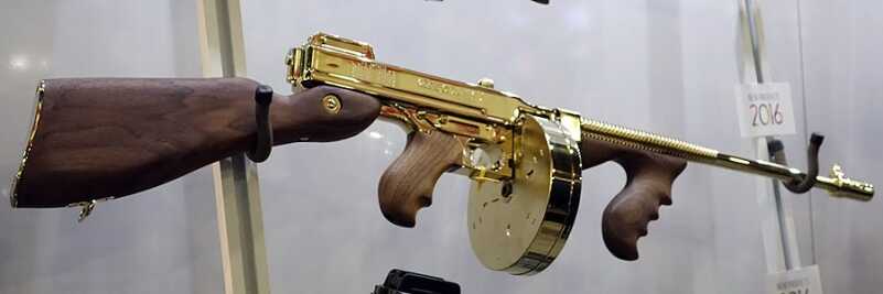 Shootable Gold Plated Tommy Guns, Stainless Desert Eagles - Thompson & Magnum Research - SHOT Show 2016 Few fighting guns look good dressed up in gold. This one looks great.