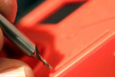 Drill out the pin holes...