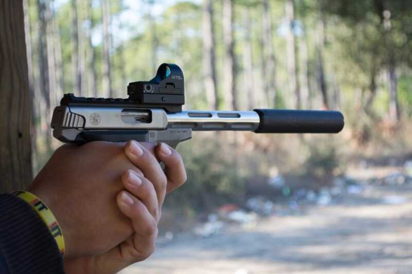 The Victory shown here with the Volquartsen I-Fluted barrel, Silencerco Sparrow suppressor and C-More RTS2 red dot sight.