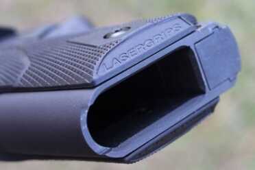 New Gun Review: Springfield 1911, Loaded Parkerized with Crimson Trace The grips are pretty slim but they do feel a little bulky in the hand compared to standard grips.