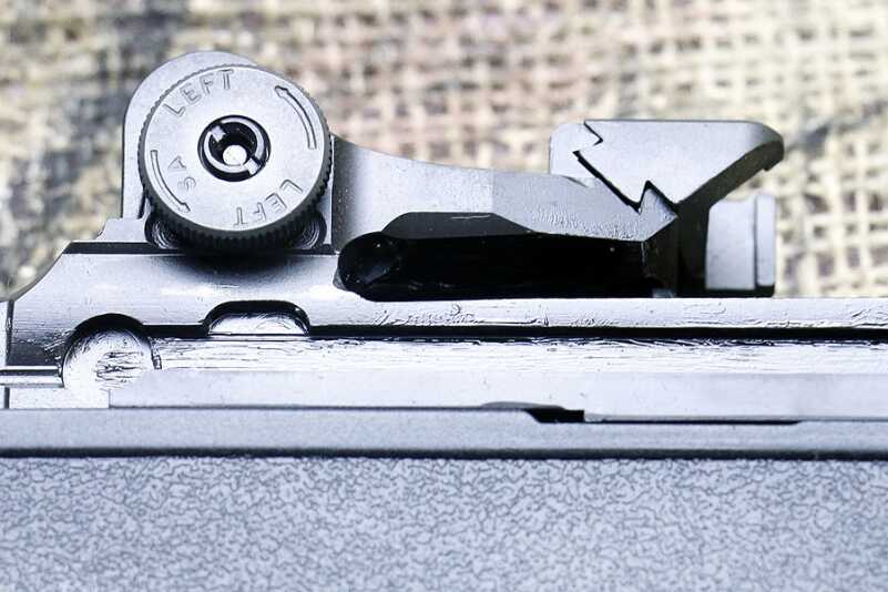 The rear sight and base for a scope mount.