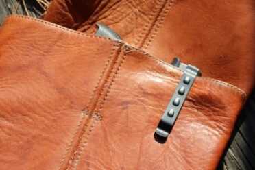 The GLOCK in the boot doesn't hide as easily as the Kel-TEC. 