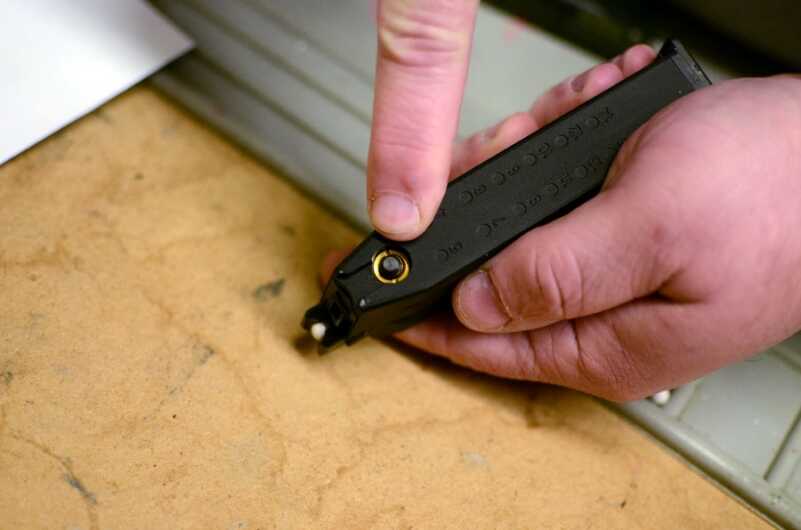 The rear of the mag has a button to allow you to safely de-gas the mag when training is complete.