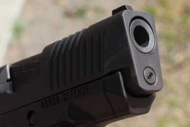 Nice crown on the barrel, and note the flared sides, which make holstering easier.