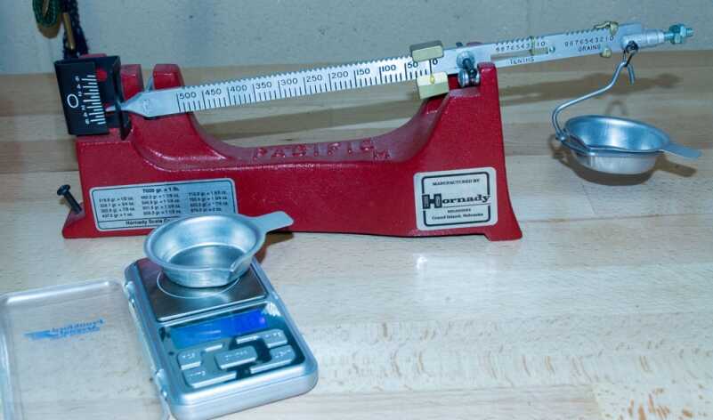 You need a powder scale and both beam and electronic ones work fine.