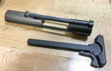 Review: Smith & Wesson M&P 15-22 Performance Center Rifle The bolt works a little differently given the rimfire pressures. Note the tiny (in comparison) recoil spring.