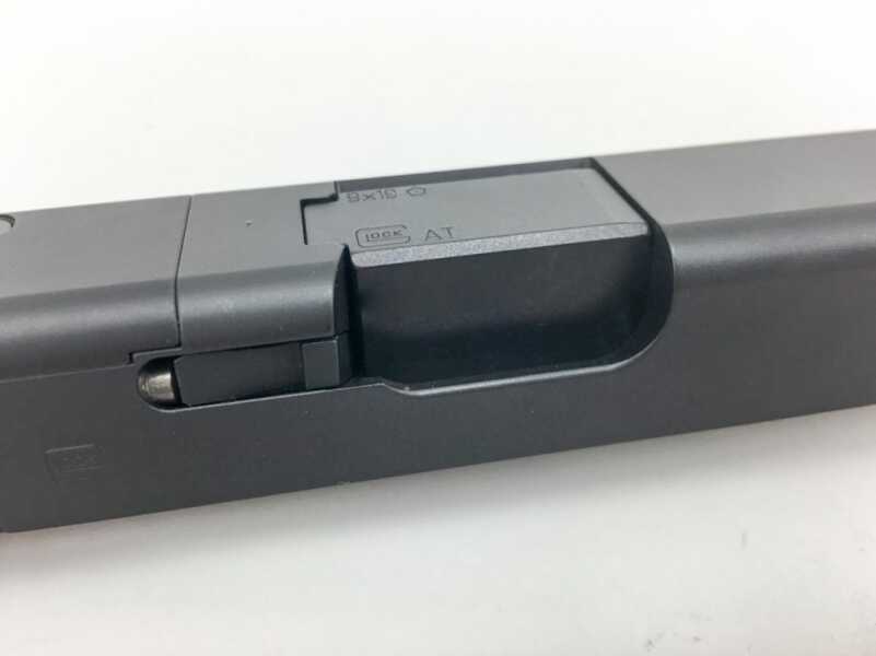 Many semi-automatic pistols, like this Glock 19, lock via fit between the barrel and the ejection port.