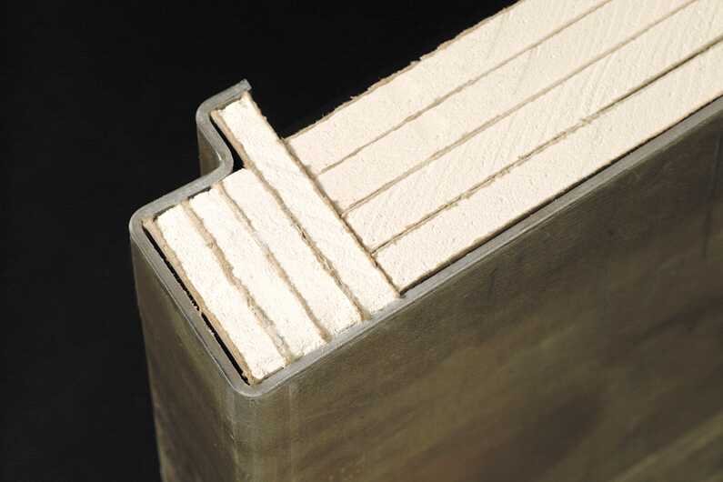 Shown is a composite safe door with bent seams and waterjet-cut fireboard that fits tight. This helps protect the interior during a fire. Image courtesy of Liberty Safe. 