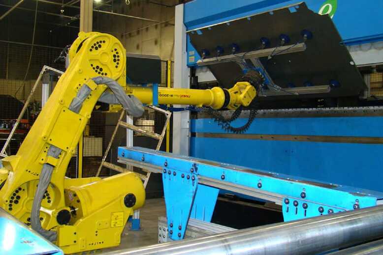 Shown here is a robotic arm folding a composite door. Image courtesy of Liberty Safe.