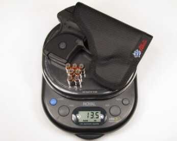 The LCP Custom weighs 9.7 ounces. Fully loaded with a pocket holster increases the weight to a scant 13.5 ounces.