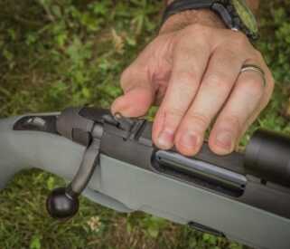 At the rear of the receiver on the Steyr Scout Rifle you will find a pop up ghost ring aperture sight.