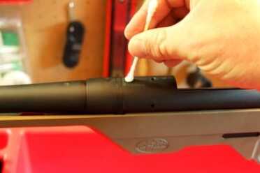 Use a degreasing agent to clean out the screw holes in the action in addition to the screws and any bearing surfaces.