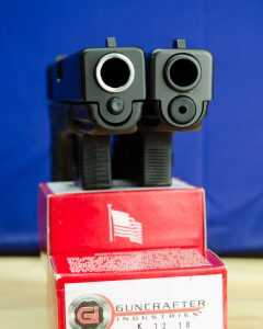 Side by side with the Glock 21. Can you tell which is which?