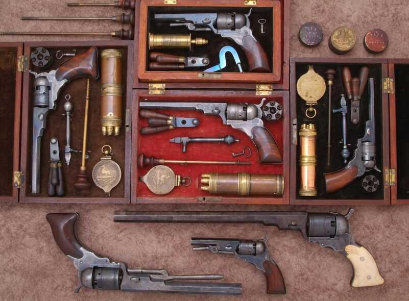 The Paterson lineage is shown beginning top center with a fine Ehlers No.2 Improved .31 caliber Pocket Model with loading lever. Below that another No. 2 Model with vine scroll engraving. To the right, a rare flat bottom grip No. 2 Model. At far right a No. 3 Model with 5-1/2 inch barrel. Across the bottom, at top a very rare No. 5 Texas Paterson with 12-inch barrel, center, a First Model New Improved Ehlers with loading lever, and a No.5 Holster Model with 7-1/2 inch barrel. (Dennis Levett collection).