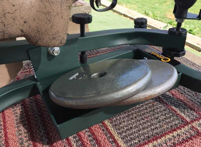 Although the Lead Sled Solos tray is designed to accept a lead shot bag, the author did a field-expedient adaptation with these weights.