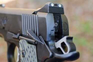 Note the extended beaver tail grip safety and tritium rear sight unit.