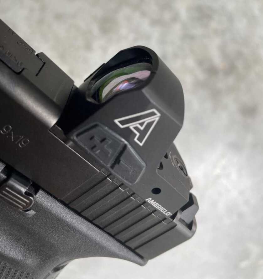 Control buttons on an Ameriglo Haven red dot optic.