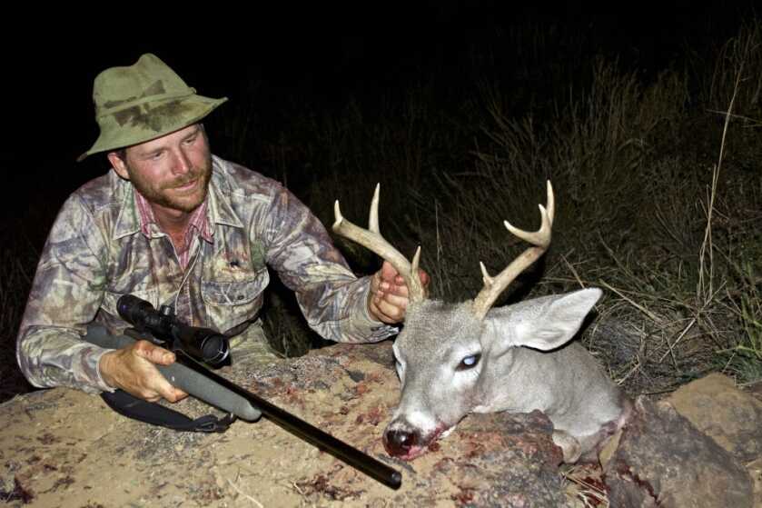 TAKE THE SHOT: Coues Deer At Last Light Hunter with his coues deer and his rifle