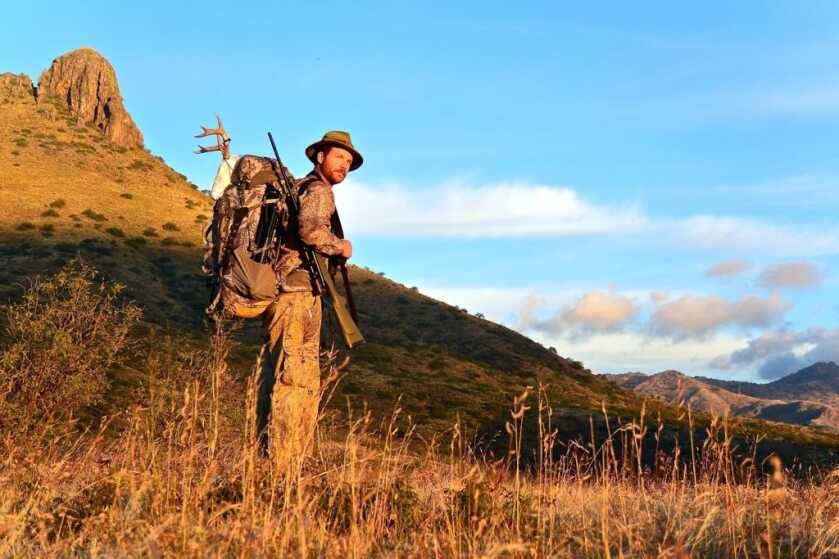 TAKE THE SHOT: Coues Deer At Last Light Hunter in the mountains with gun and coues deer