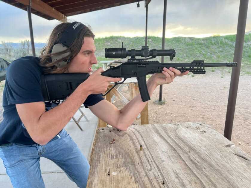 Tombstone 9mm: POF's Classic Lever Action with AR Styling POF Tombstone 9mm shot by a young man with an elbow resting on a bench.