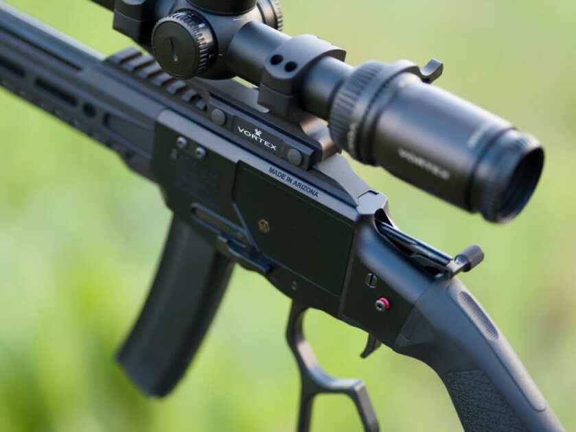 Tombstone 9mm: POF's Classic Lever Action with AR Styling POF Tombstone 9mm closeup of the receiver. The action is open, the hammer is back, and the safety button is set to fire.